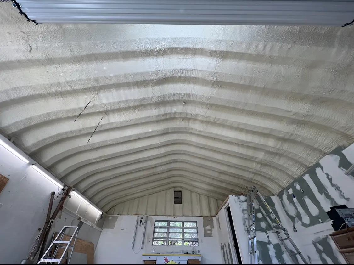 Spray polyurethane foam applied to the underside of a metal roof deck in Romeoville